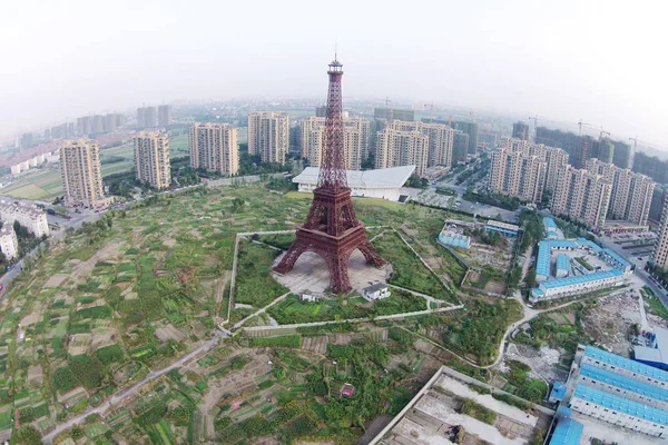 Downsized Replication Eiffel Tower Surrounded Vegetable Fields Residential Apartment Buildings — Stock Photo, Image