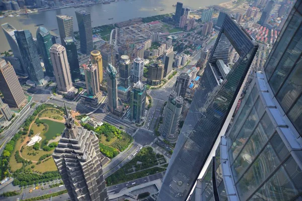 This picture taken from high in the Shanghai Tower under construction shows a view of Huangpu River and the Lujiazui Financial District with the Jinmao Tower, front left, the Shanghai World Financial Center, front right, and other skyscrapers and hig