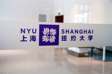 A logo of New York University Shanghai (NYU Shanghai) is seen in the teaching building at the campus of New York University Shanghai (NYU Shanghai) in the Lujiazui Financial District in Pudong, Shanghai, China, 7 August 2014.   clipart