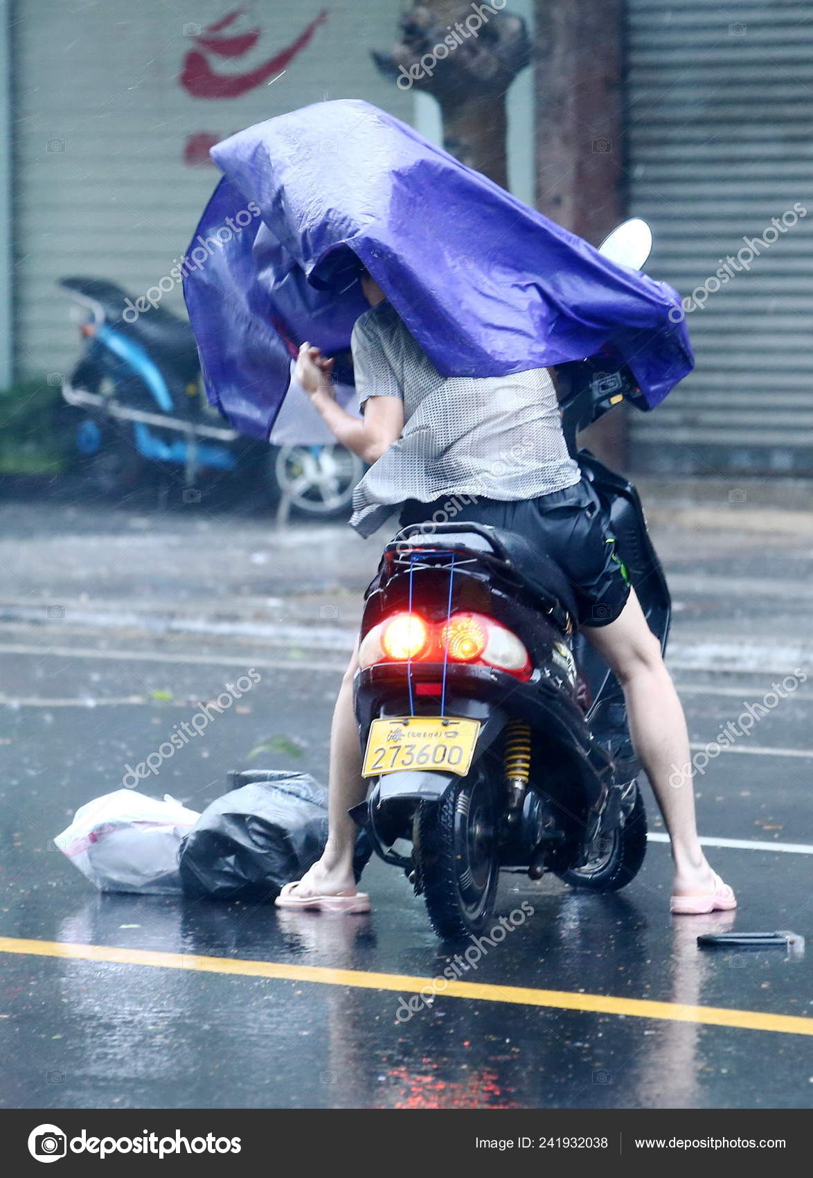 The Rain Riding Ebike In Rain Man Struggles His Raincoat Electric
