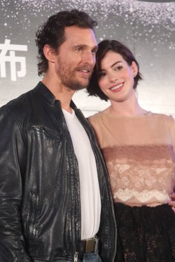American actor Matthew McConaughey, left, and actress Anne Hathaway pose during a press conference for their new movie 