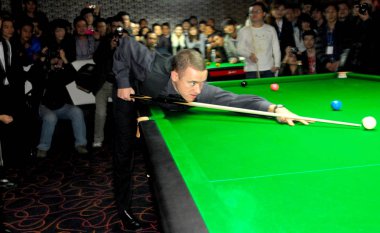 Scottish professional snooker player Stephen Hendry performs at the opening ceremony of a billiard parlor in Nanning city, south Chinas Guangxi Zhuang Autonomous Region, 10 January 2012. clipart