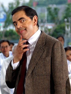 English actor Rowan Atkinson plays Mr. Bean during a filming session for a TV commercial at the Mercedes-Benz Arena in Shanghai, China, 20 August 2014. clipart