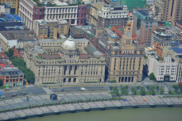 This picture taken from high in the Shanghai Tower under construction in Pudong shows a view of Huangpu River and Puxi with colonial buildings along the promenade on the Bund and other buildings in Shanghai, China, 30 August 2014.