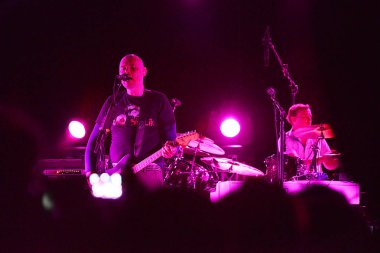 Members of American alternative rock  band Smashing Pumpkins perform during their concert in Hong Kong, China, 14 August 2013.