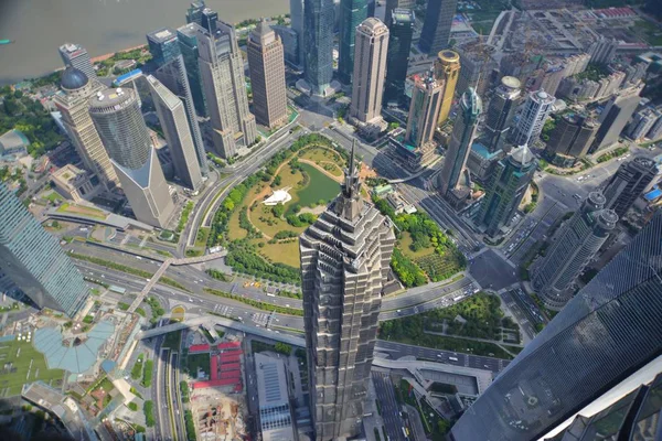 This picture taken from high in the Shanghai Tower under construction shows a view of Huangpu River and the Lujiazui Financial District with the Jinmao Tower, front left, the Shanghai World Financial Center, front right, and other skyscrapers and hig