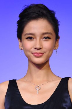 Hong Kong actress and model Angelababy smiles during a press conference for jewelry brand CsC in Beijing, China, 8 July 2013.  clipart