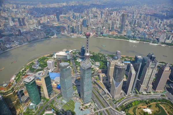 This picture taken from high in the Shanghai Tower under construction shows a view of Puxi, Huangpu River and the Lujiazui Financial District with the Oriental Pearl TV Tower, center tallest, and other skyscrapers and high-rise buildings in Pudong in