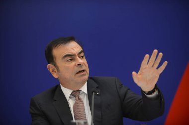 Carlos Ghosn, Chairman and CEO of Renault SA, speaks during a press conference about the establishment of a car-making joint venture, Dongfeng Renault Automotive Co., with Chinas Dongfeng Motor Group Co. in Wuhan city, central Chinas Hubei province,  clipart