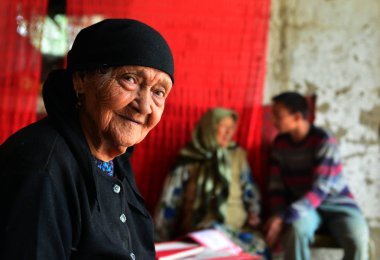 Chinese Uighur woman Ali Mihan, front, 127 years old, is pictured at home in Shule county, Kashgar Prefecture, northwest Chinas Xinjiang Uygur Autonomous Region, 16 August 2013 clipart