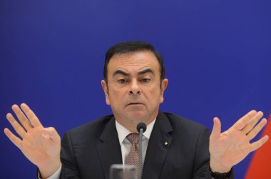 Carlos Ghosn, Chairman and CEO of Renault SA, is pictured during a press conference about the establishment of a car-making joint venture, Dongfeng Renault Automotive Co., with Chinas Dongfeng Motor Group Co. in Wuhan city, central Chinas Hubei provi clipart