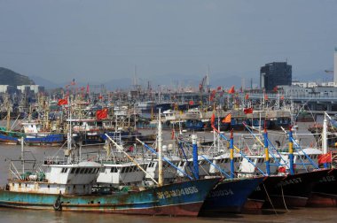 Fishing boats docked at the Zhoushan port before typhoon Fitow attack in Zhoushan, east Chinas Zhejiang province, 4 October 2013. clipart