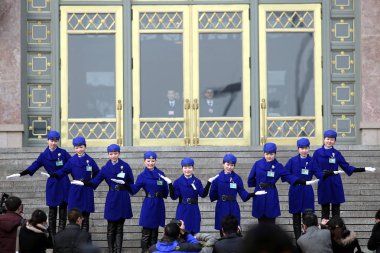 Chinese hostesses pose for photographers in front of the Great Hall of the People in Beijing, China, 4 March 2012 clipart