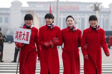 Chinese hostesses parade in front of the Great Hall of the People in Beijing, China, 4 March 2012 clipart