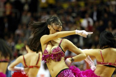 Sexy cheerleaders dance in the third final match of the 2011/2012 CBA Season between Beijing Ducks and Guangdong Tigers in Dongguan city, south Chinas Guangdong province, 25 March 2012 clipart
