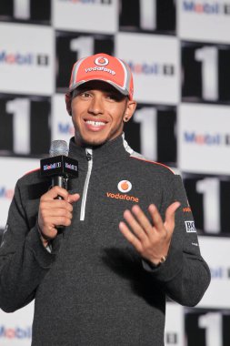 British F1 driver Lewis Hamilton, currently racing for the McLaren team, speaks during a promotional activity in Shanghai, China, 11 April 2012. clipart