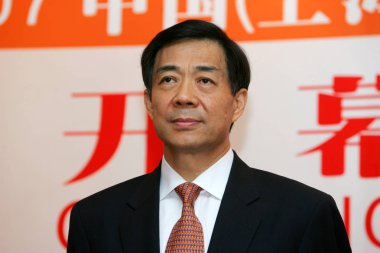 Bo Xilai, then Minister of Commerce of China and son of former Chinese Vice Premier Bo Yibo, poses at the opening ceremony for the 2007 China International Sourcing Fair (ISF China) in Shanghai, China, 25 September 2007. clipart