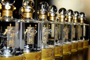 Bottles of Shui Jing Fang baijiu are seen at a specialty store in Beijing, China, 2 October 2011.   clipart