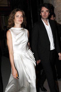 Russian supermodel Natalia Vodianova and her boyfriend Antoine Arnault leave Roosevelt Wine Cellar Lounge & Restaurant after the Christian Dior Spring/Summer 2012 Paris Haute Couture fashion show in Shanghai, China, 14 April 2012. clipart