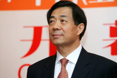 Bo Xilai, then Minister of Commerce of China and son of former Chinese Vice Premier Bo Yibo, poses at the opening ceremony for the 2007 China International Sourcing Fair (ISF China) in Shanghai, China, 25 September 2007. clipart