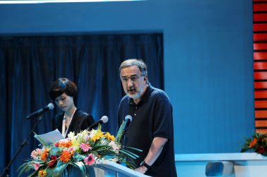 Sergio Marchionne, Chairman and CEO of Chrysler Group LLC and CEO of Fiat S.p.A., delivers a speech at the inauguration of the GAC Fiat WCM plant and the off-line ceremony for the Fiat Viaggio in Changsha city, central Chinas Hunan province, 28 June  clipart