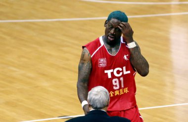 NBA star Dennis Rodman of the US Pro-ball Legend is pictured in a friendly basketball match against the Beijing Ducks during the US Pro-ball Legend China tour in Wuxi city, east Chinas Jiangsu province, 30 April 2012 clipart