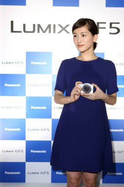 Japanese actress Haruka Ayase poses with a camera during the Panasonics promotional activity in Taipei, Taiwan, 10 June 2012. clipart