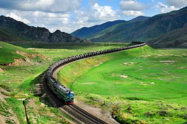 A freight train with liquid cargo travels on the Guanjiao Extension Rail of the Qinghai-Tibet Railway in Tianjun county, Haixi Mongol and Tibetan Autonomous Prefecture, northwest Chinas Qinghai province, 21 July 2009 clipart