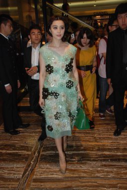 Chinese actress Fan Bingbing poses during the Louis Vuitton Maison opening ceremony in Shanghai, China, 18 July 2012. clipart