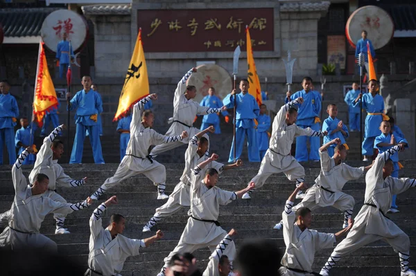 stock image Shaolin monks perform at a welcome ceremony of the 9th Zhengzhou International Shaolin Wushu Festival at Shaolin Temple in Zhengzhou city, central Chinas Henan province, 22 October 2012