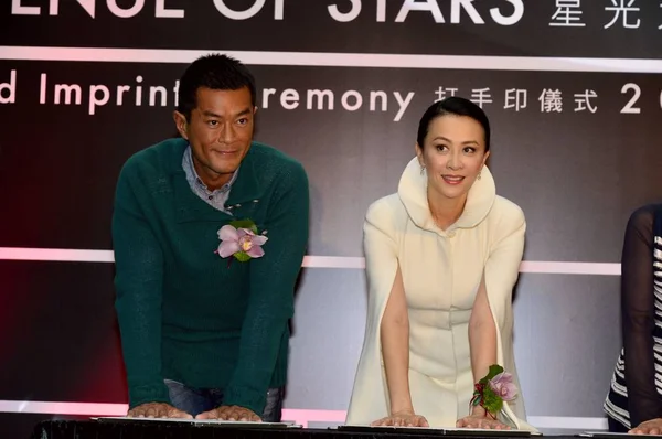 From second left) Hong Kong actor Simon Yam, Charlene Choi of Hong Kong pop  duo Twins and Hollywood action star Jean-Claude Van Damme pose on the red  Stock Photo - Alamy
