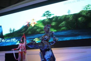 Cosplayers perform during the 10th China Digital Entertainment Expo & Conference, also known as ChinaJoy 2012, at the Shanghai New International Center in Shanghai, China, 26 July 2012 clipart