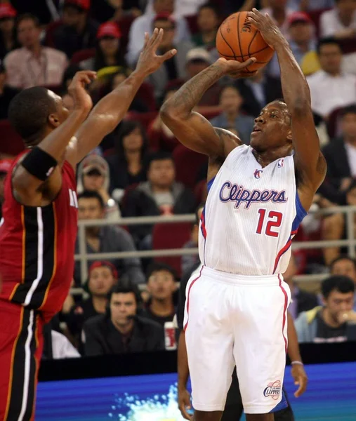 LeBron James of the Miami Heat, right, challenges Chris Paul of the Los  Angeles Clippers during their second match of the NBA China Games in  Shanghai Stock Photo - Alamy