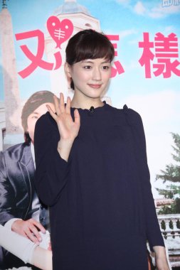 Japanese actress Haruka Ayase greets media during the press conference for her new movie, Hotaru no Hikari, in Taipei, Taiwan, 9 June 2012. clipart