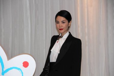Hong Kong singer Faye Wong poses during a charity event in Beijing, China, 27 May 2012.  clipart
