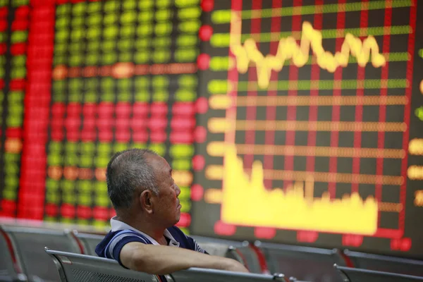 Chinese Investor Looks Prices Shares Red Price Rising Green Price — Stock Photo, Image