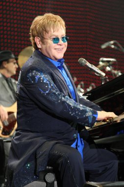 English singer Elton John performs during his concert at the Hong Kong Convention and Exhibition Centre in Hong Kong, China, 4 December 2012.