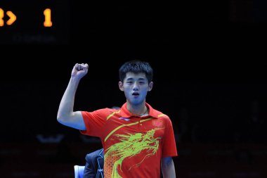Chinas Zhang Jike reacts while competing against Joo Sehyuk of South Korea in the final of the mens team table tennis during the London 2012 Olympic Games in London, UK, 8 August 2012. clipart