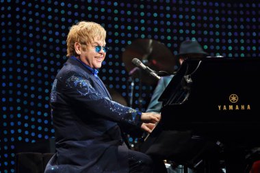 English singer Elton John performs during his concert at the Mercedes-Benz Arena in Shanghai, China, 23 November 2012.