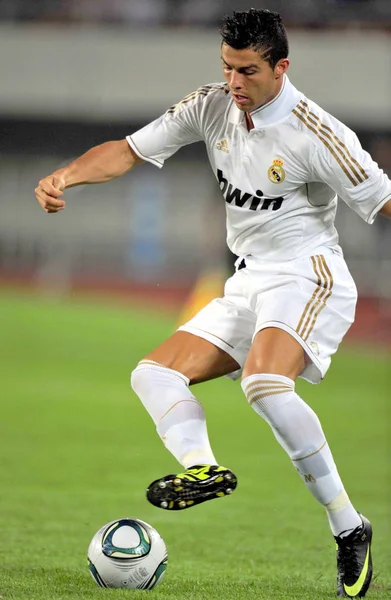 stock image Cristiano Ronaldo of Real Madrid challenges Guangzhou Evergrande in a friendly soccer match in Guangzhou city, south Chinas Guangdong province, 3 August 2011