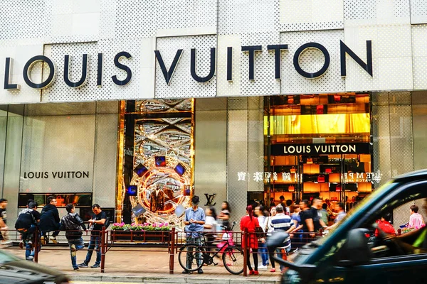 Customers walk past a Louis Vuitton (LV) store at a shopping mall in  Shanghai, China, 1 September 2015. At the beginning of 2013, a 65 year-old  stea Stock Photo - Alamy