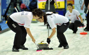Players of Japan compete in the womens bronze final match against New Zealand during the Pacific-Asia Curling Championships 2011 in Nanjing city, east Chinas Jiangsu province, 26 November 2011 clipart