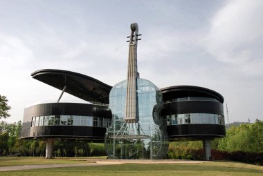 The piano-violin-shaped Urban Planning Exhibition Hall of Shannan New Area is pictured in Huainan City, east Chinas Anhui Province, 25 April 2011 clipart