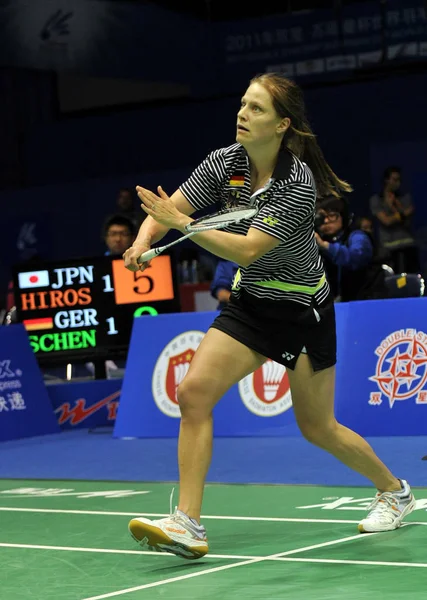 stock image Germanys Juliane Schenk returns a shot against Japans Eriko Hirose during the womens single match at the BWF badminton Sudirman Cup 2011 in Qingdao, east Chinas Shandong province, 23 May 2011