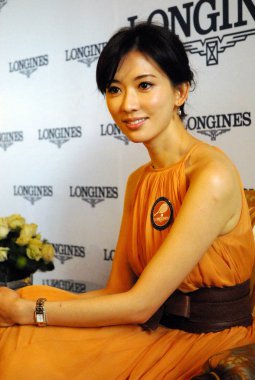 Taiwanese model and actress Lin Chi-ling attends a commercial campaign to promote Longines in Qingdao, east Chinas Shandong province, 08 May 2011. clipart