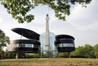 The piano-violin-shaped Urban Planning Exhibition Hall of Shannan New Area is pictured in Huainan City, east Chinas Anhui Province, 25 April 2011 clipart