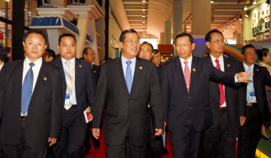 Cambodias Prime Minister Hun Sen (3rd left) and other officials attend the 8th China-ASEAN Business and Investment Summit (CABIS) in Nanning, southwest Chinas Guangxi Zhuang Autonomous Region, 21 October 2011 clipart