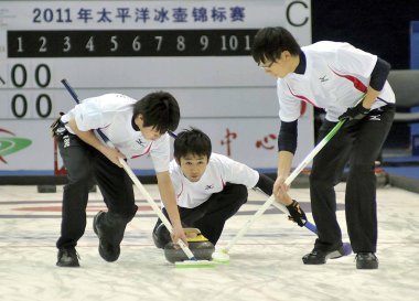 Players of Japan compete in a mens double round-robin match against Chinese Taipei during the Pacific-Asia Curling Championships 2011 in Nanjing city, east Chinas Jiangsu province, 19 November 2011 clipart