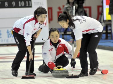 Players of Japan compete in a womens double round-robin match against New Zealand during the Pacific-Asia Curling Championships 2011 in Nanjing city, east Chinas Jiangsu province, 19 November 2011 clipart