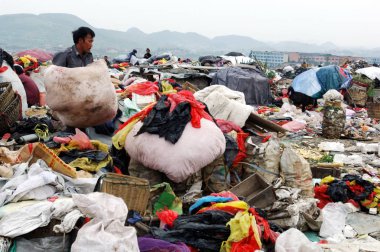 Chinese junkmen search garbage for useful products at a landfill on the outskirts of Guiyang city, southwest Chinas Guizhou province, 4 September 2007 clipart